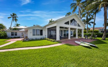 Lykos residential remodel - Front elevation with paddle boards